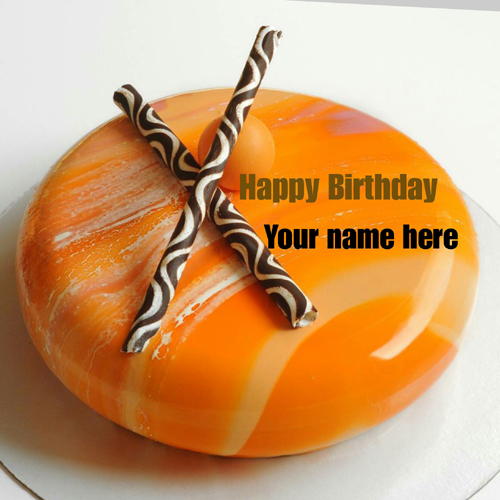 Write Name On Orange Birthday Cake With Chocolate Stick