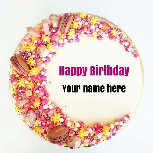 Multicoloured flower decorated birthday cake with name 